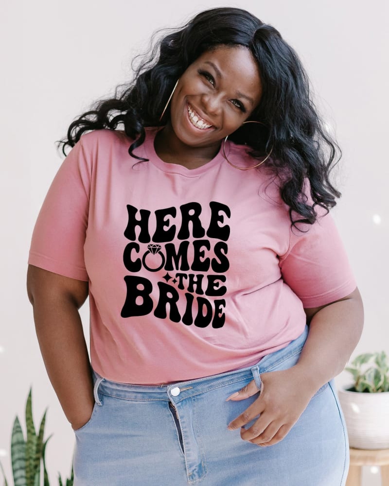 Front of a model wearing a size Large Here Comes The Bride in Mauve by Simply Sage Market. | dia_product_style_image_id:281303